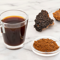 A collection of chaga mushrooms, mushroom extract, and a water-soluble mixture. Mógū Mushrooms offers high quality wholesale mushroom extracts like chaga and lion's mane.